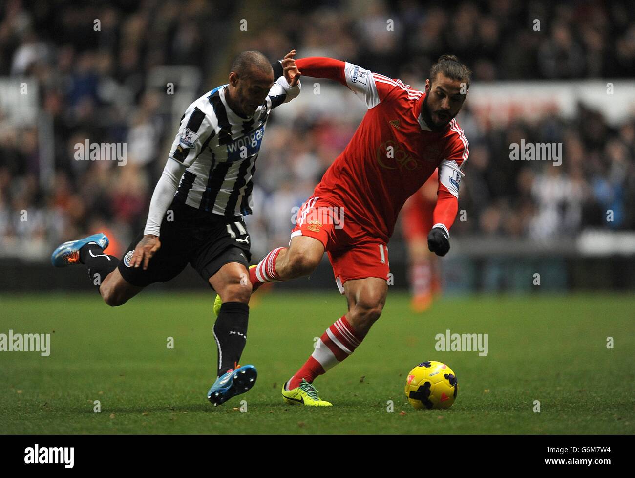 Newcastle United's Yoan Gouffran (left) and Southampton's Pablo Osvaldo battle for the ball Stock Photo