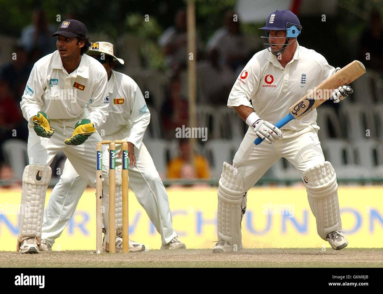 Graham Thorpe (right) pushes the ball past Kumar Sangakkara (left) to score a half century as England continued their first innings against Sri Lanka at the Asgiriya Stadium in Kandy on the third day of the second Test in the three match series. Stock Photo
