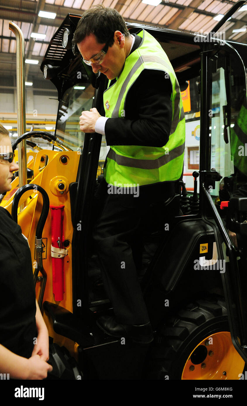 The Chancellor of the Exchequer George Osborne during a visit to JCB's backhoe loader factory in Rocester, Staffordshire. JCB announced today plans to invest &pound;150 million to expand its operations in Staffordshire and create an additional 2.500 jobs by 2018. Stock Photo