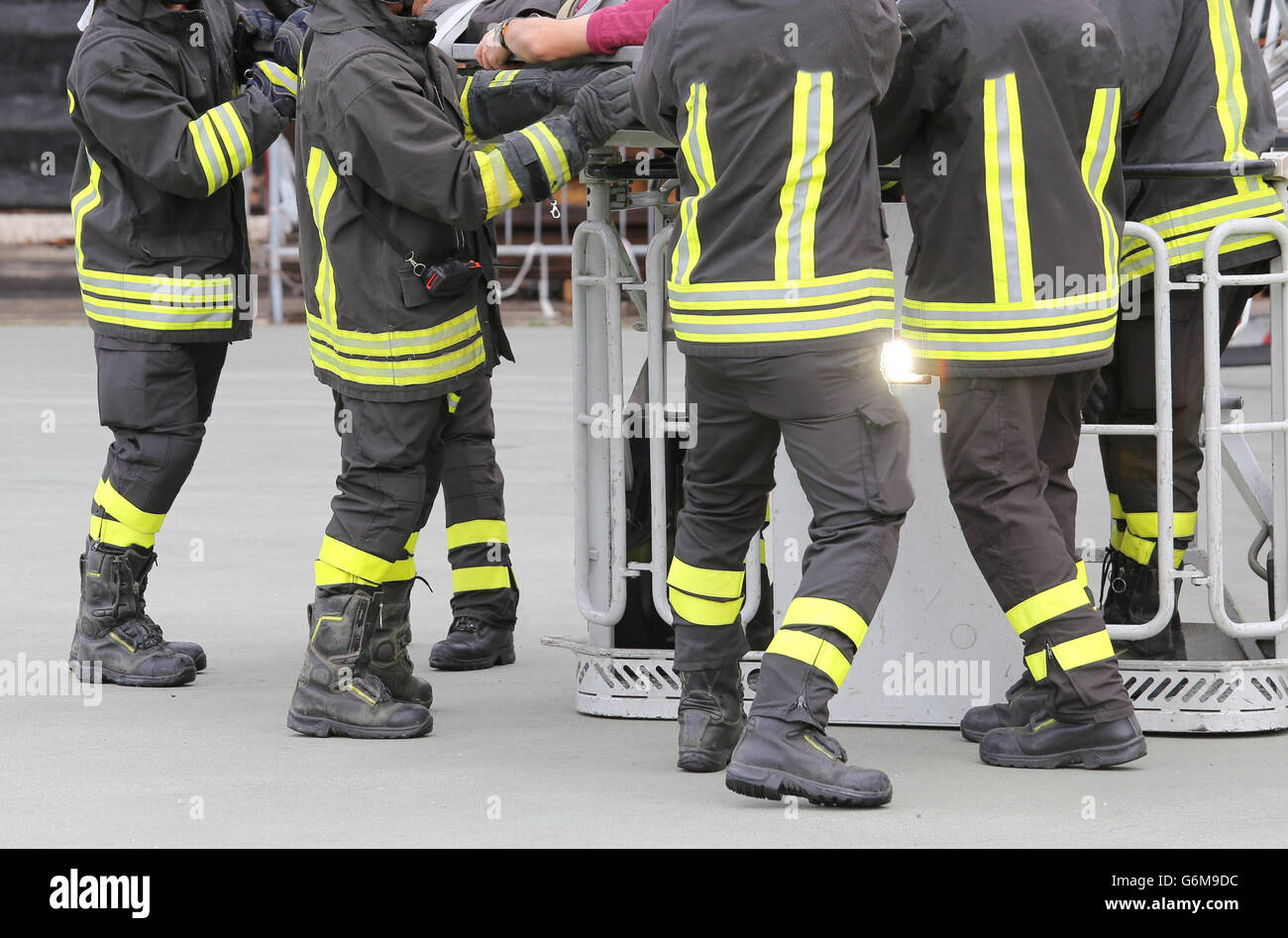 firefighters in the fire truck basket during the practice of training