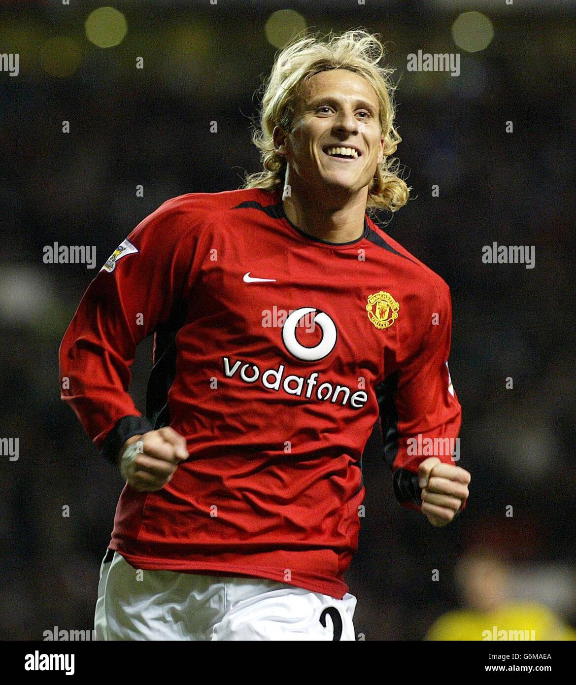 Manchester United's Diego Forlan celebrates scoring the fourth goal against Aston Villa during the Barclaycard Premiership match at Old Trafford, Manchester. Manchester United won 4-0. 21/08/04: Manchester United's Diego Forlan was introduced as a Villarreal player after passing his medical and agreeing terms on a five-year contract with the Primera Liga club who have paid an undisclosed fee. Stock Photo
