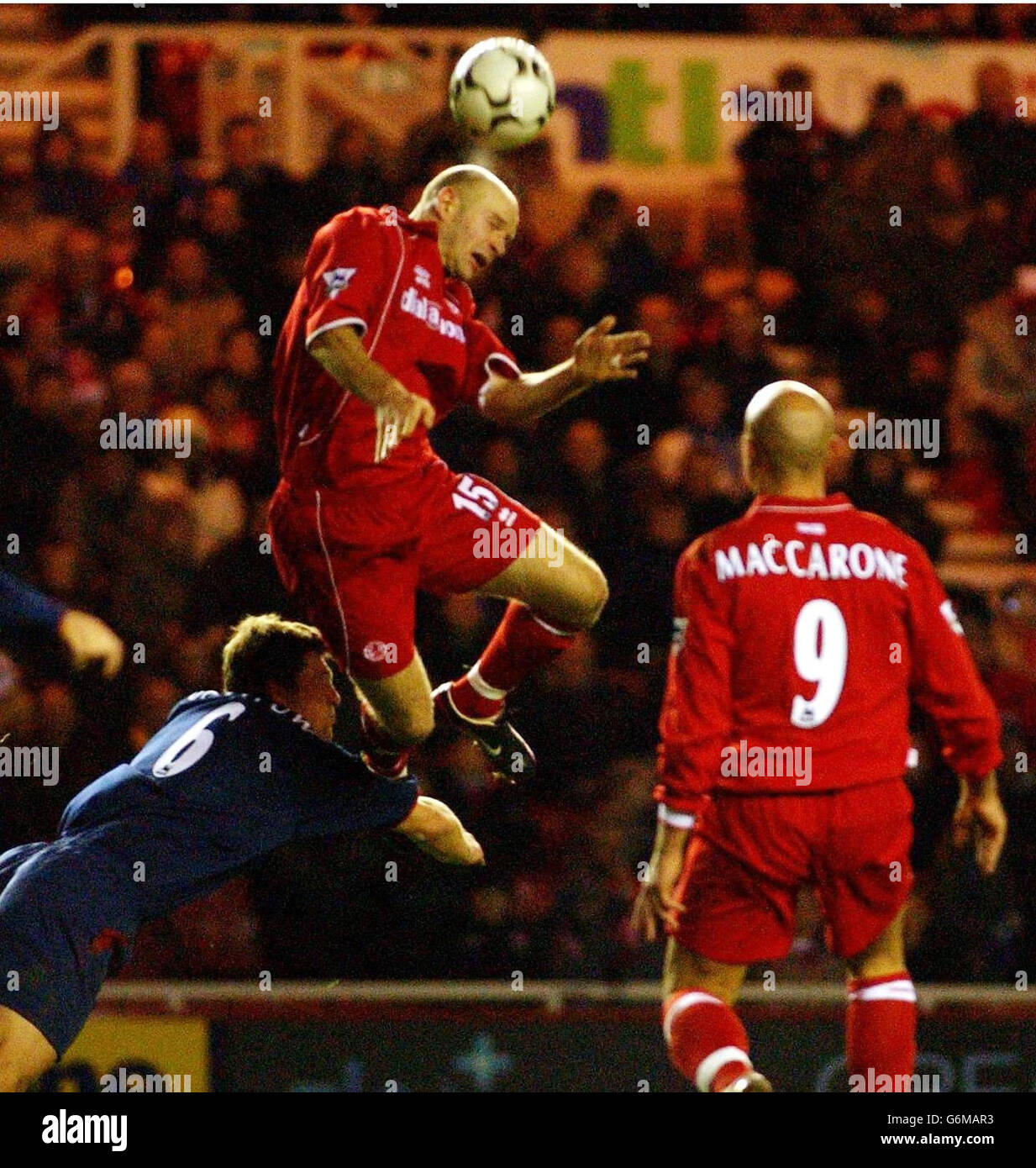 Middlesbrough's Danny Mills launches himself over Arjan De Zeeuw of Portsmouth, during the Barclaycard Premiership match at the Riverside Stadium, Middlesbrough. Final score: Middlesbrough nil, Portsmouth nil. Stock Photo