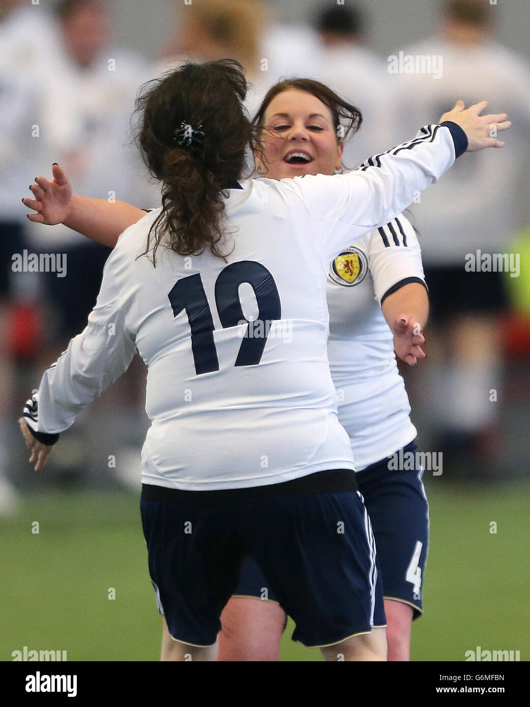 Comedians Sharon Rooney runs towards Janey Godley during a charity