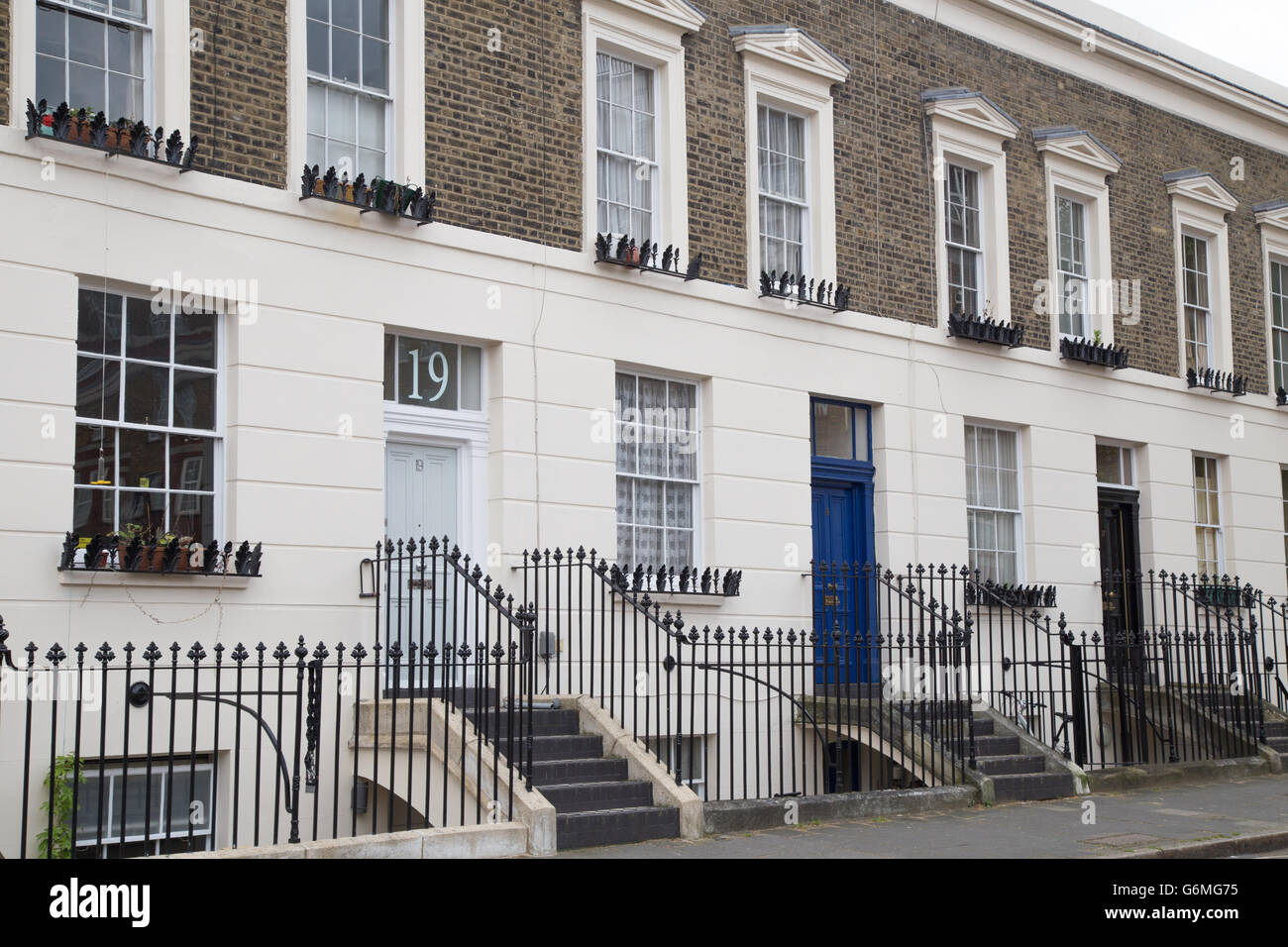 exterior terrace of central London townhouses from late Georgian/early  Victorian period in Wren Street, London WC1 Stock Photo - Alamy