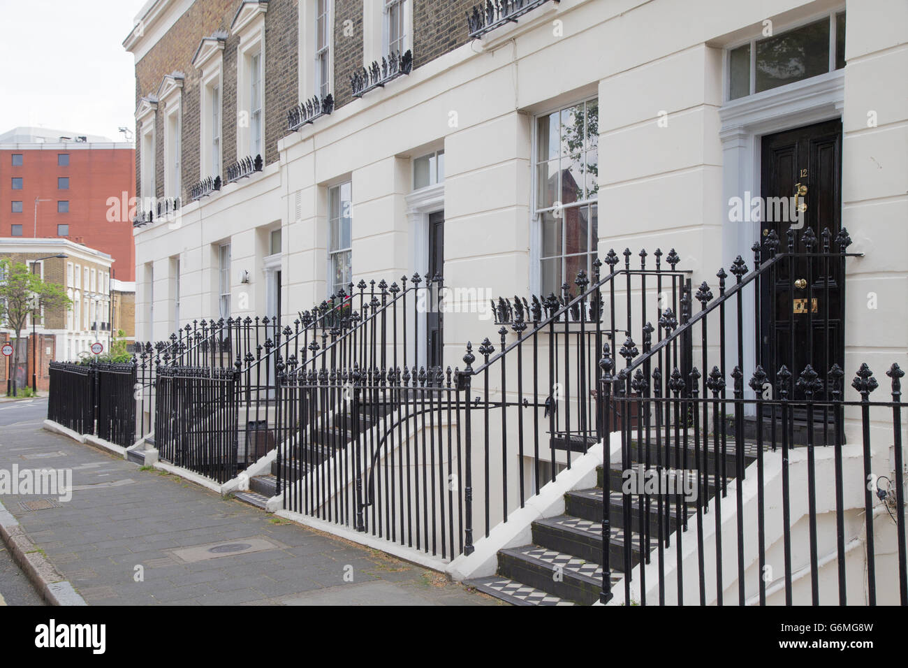 doorways and railings of terraced late / early Victorian town