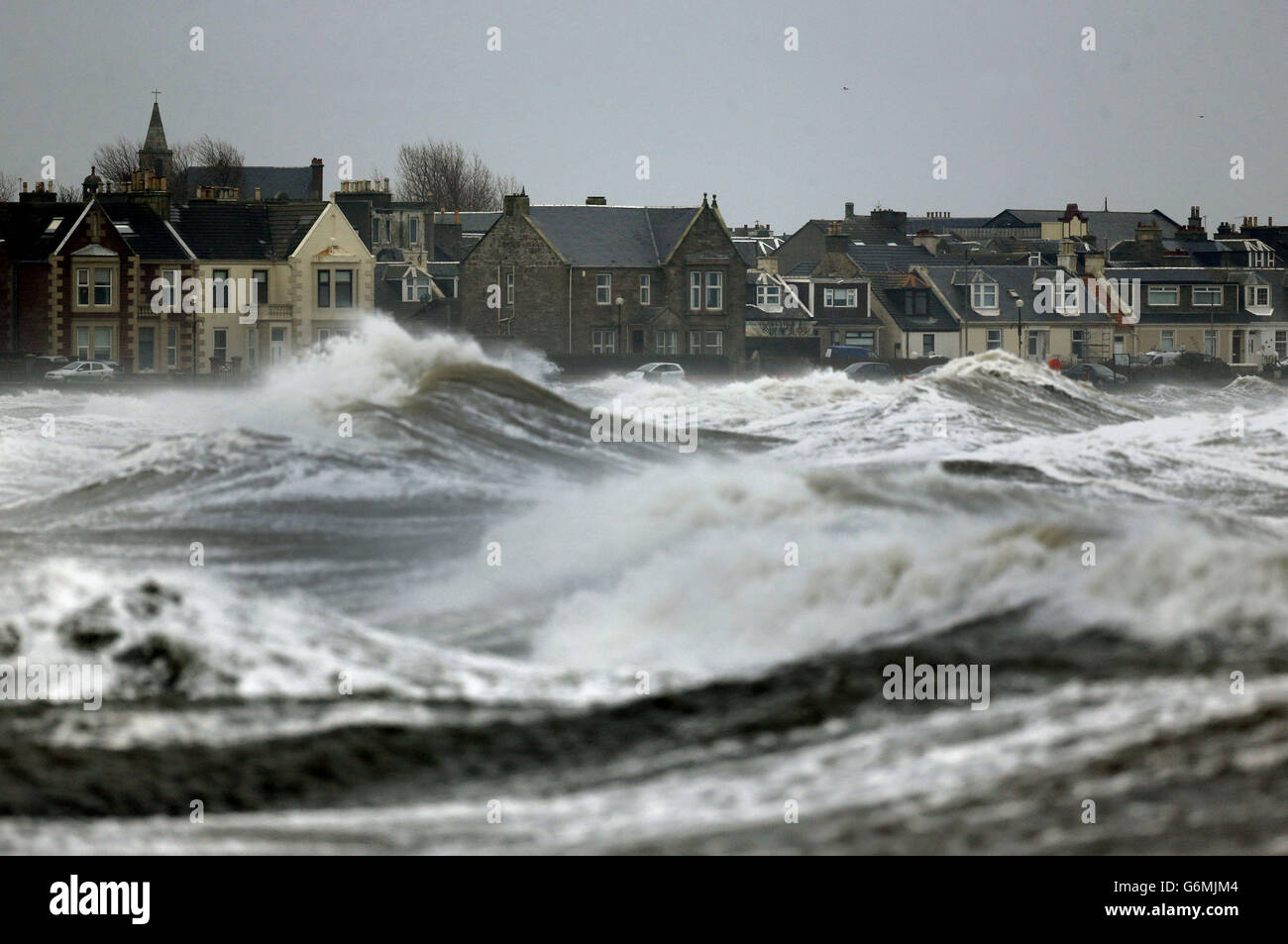 Waves brake at Ardrossan in Scotland as Britain experiences further bad weather. Stock Photo