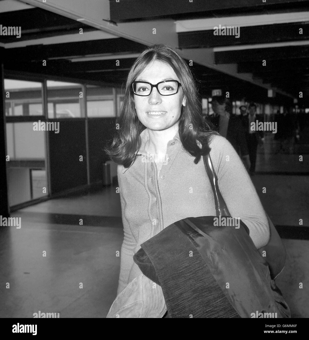 Greek singer Nana Mouskouri at Heathrow Airport, London, to attend a reception at the Savoy Hotel, where she will be presented with a golden disc for her long-playing record 'Over and Over'. Nana's new BBC television series starts on Thursday and the following day she begins a nationwide tour. Stock Photo