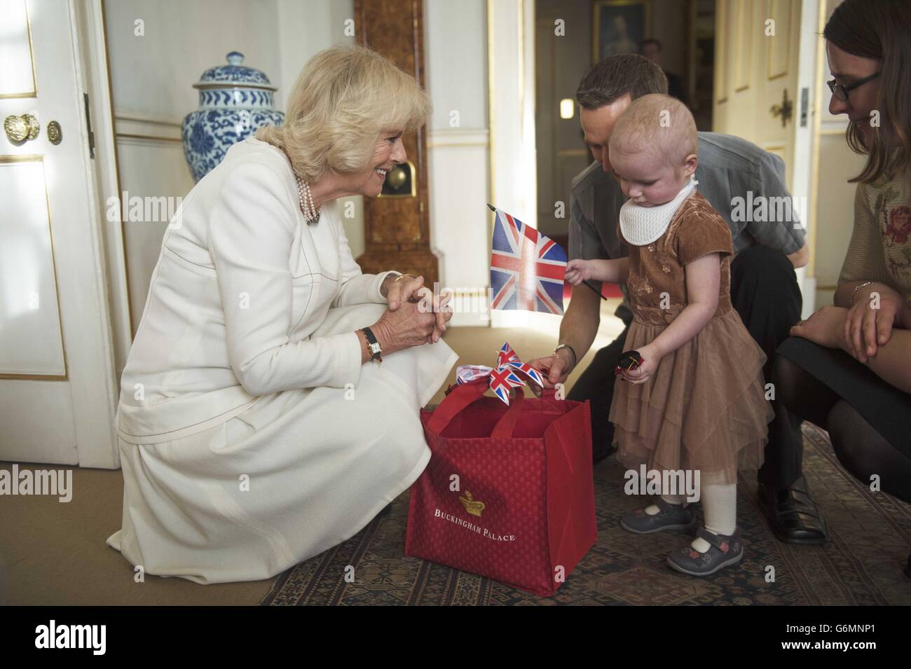 RETRANSMITTED CORRECTING TOPIC AND KEYWORD Lorna Gentry meets the Duchess of Cornwall who was hosting her annual reception for youngsters and their carers from Helen and Douglas House, where they helped decorate a Christmas Tree at Clarence House in London. Stock Photo
