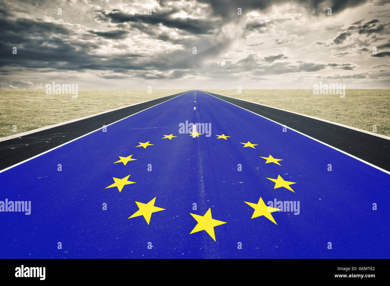 European flag, road perspective, dark clouds, crisis concept Stock Photo