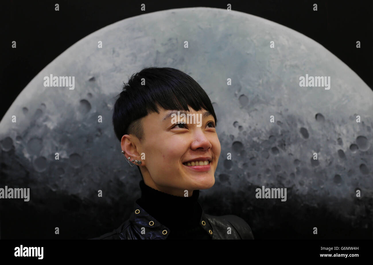 Chinese woman Ning Xiao Du at the launch of an exhibition entitled 'to the moon and back' by Irish Artist Frank O'Dea at the Kelly Hood Art Studio in Dublin. The exhibition of paintings and sculptures coincides with the Chinese unmanned Lunar landing this week. Stock Photo