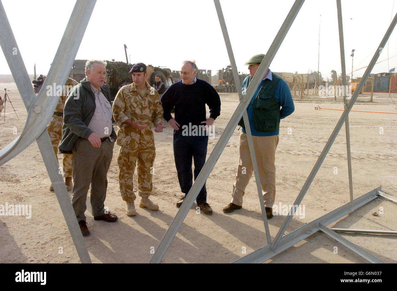 Tory leader Michael Howard (second right), Armed Forces Minister Adam Ingram (left) and shadow defence secretary Nicholas Soames with Sgt.John Marley (second left) from Horden Co Durham of 15th Field Sqd during their visit to Shaibah Logistic Base. Mr Howard joined Mr Ingram and Mr Soames for the last leg of a tour to raise troops' morale. Stock Photo