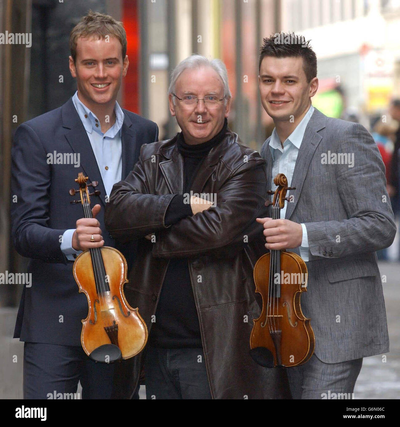 Record producer and Pop Idol judge Pete Waterman with his new signing 'Duel' - Craig Owen (left) and Greg Scott - outside Classic FM studios in central London. Pete signed the duo after hearing them busking in Manchester. Stock Photo