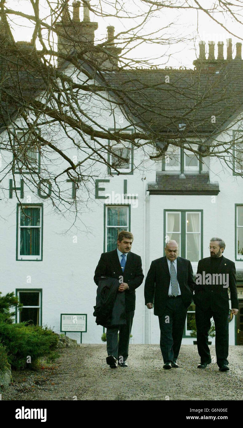 Mr Bahruz Gandilov MP, Head of the Azerbaijan delegation (left) with Mr Vaikhtang Kolbaia MP, Head of the Georgian delegation and Mr Tigran Torosyan, Head of the Armenian deligation (right), taking a break from peace talks at the Craigellachie Hotel in Moray, Friday December 19, 2003. Parliamentarians from several former Soviet republics were locked in talks in Scotland today to try to resolve a decade-long regional conflict with delegations from Armenia, Azerbaijan and Georgia arriving in Moray in the Highlands last night for two days of negotiations. Stock Photo
