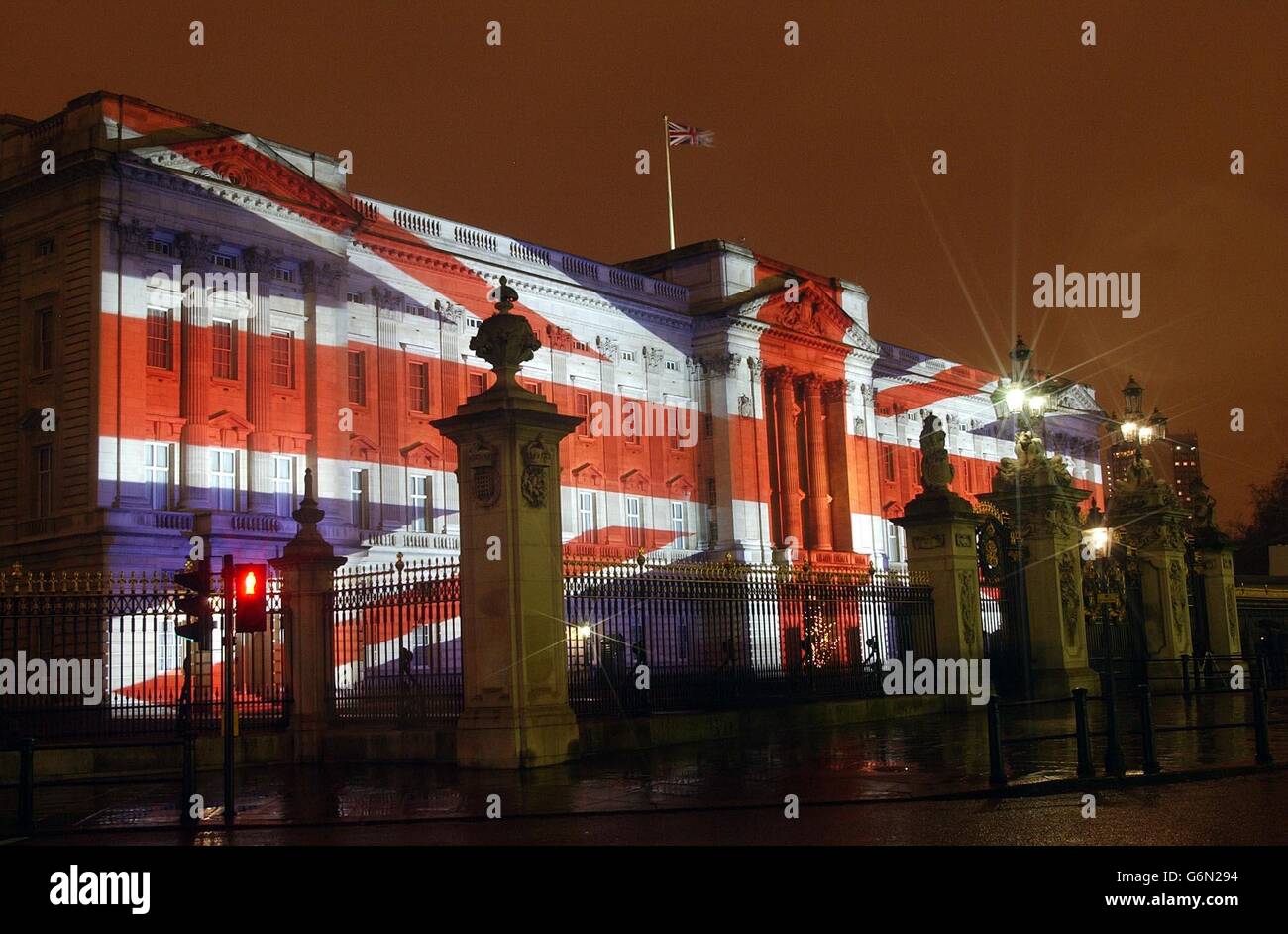 The front of Buckingham Palace floodlit at Christmas. Stock Photo