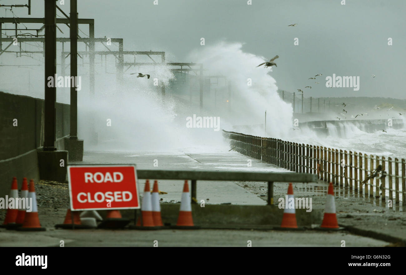 Waves hit the shore at Saltcoats in Scotland where trains where cancelled today due to the bad weather. Stock Photo