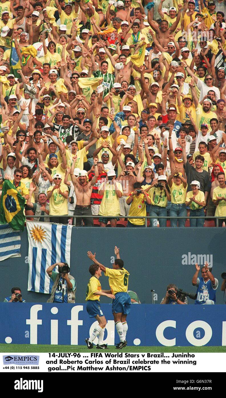 14-JULY-96, FIFA World Stars v Brazil. Juninho and Roberto Carlos of Brazil celebrate the winning goal Stock Photo