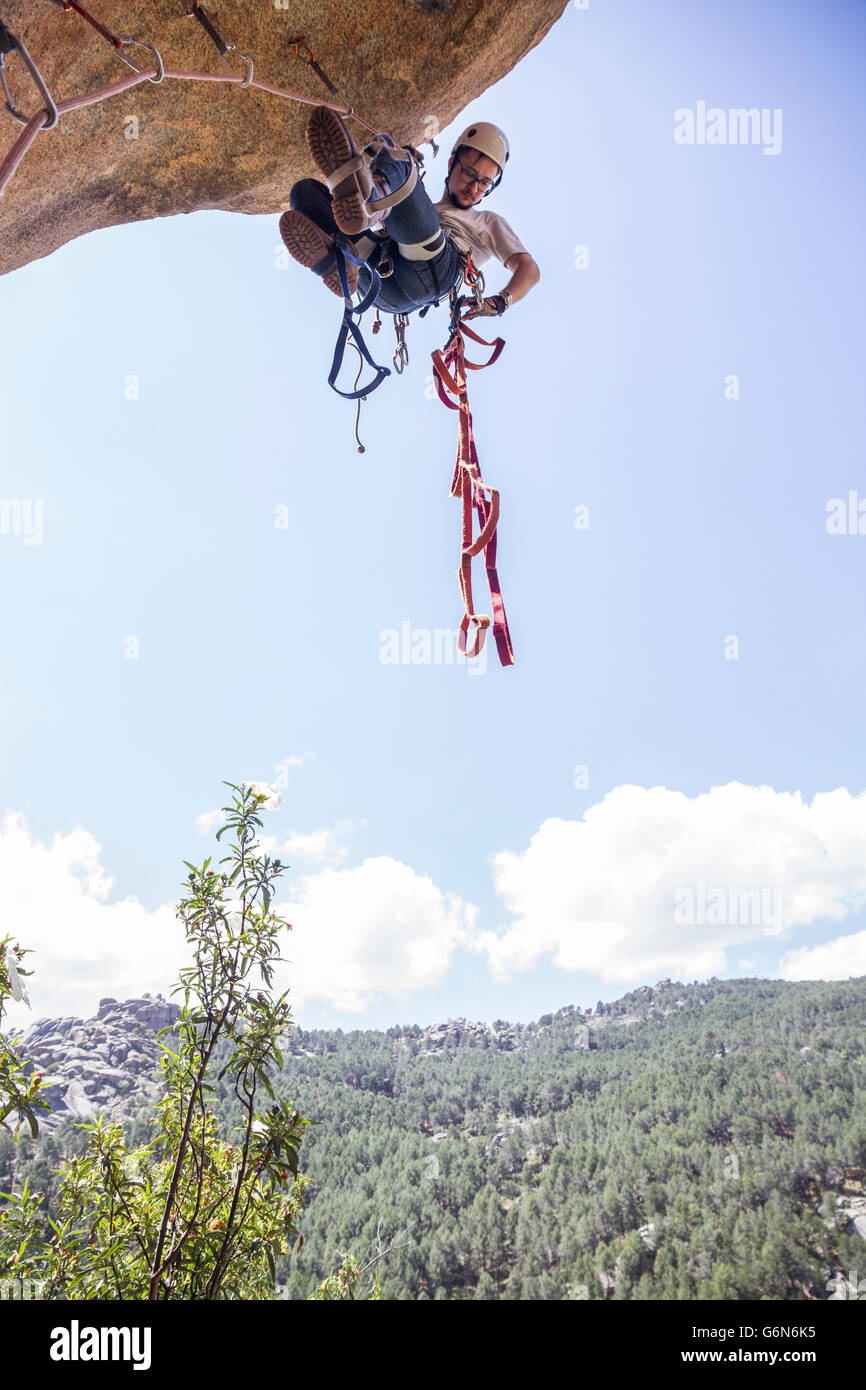 Climber climbing rock using aid climbing techniques Stock Photo Alamy