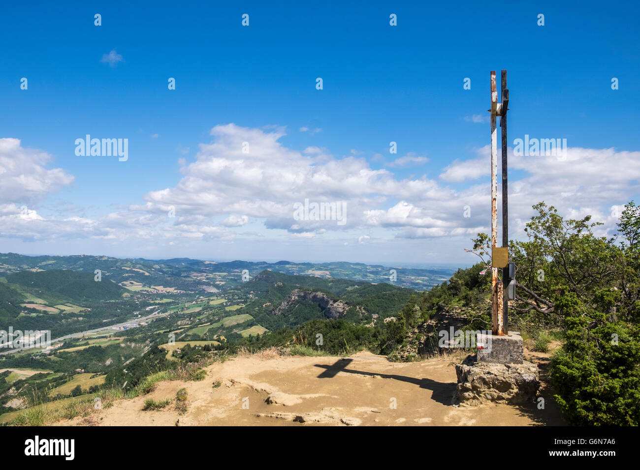 The cross at the top of Monte Adone at 655 metres above sea level overlooking the Valle del Setta near Badolo in Italy, Stock Photo