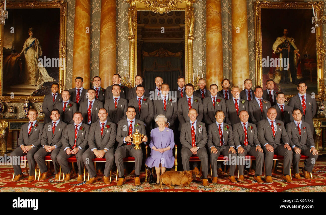 Britain's Queen Elizabeth II poses, with the England rugby squad at a reception at Buckingham Palace in London to celebrate winning the Rugby World Cup. Earlier the squad had paraded the trophy through the West End in a procession of open-topped buses. Back row (L-R): Jason Robinson, Julian White, Trevor Woodman, Steve Thompson, Mike Catt, Iain Balshaw, Dan Luger, Stuart Abbott, Andy Gomarsall, Josh Lewsey and Jason Leonard. Centre row ( L-R): Mike Tindall, Ben Cohen, Joe Worsley, Martin Corry, Ben Kay, Danny Grewcock, Will Greenwood, Lewis Moody, Richard Hill, Mark Regan and Simon Shaw. Stock Photo