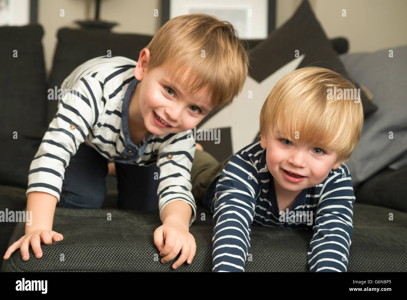 Two little boys playing at home Stock Photo - Alamy