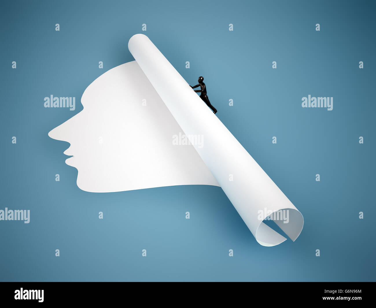 Tiny person rolling up a face-shaped piece of paper. Stock Photo