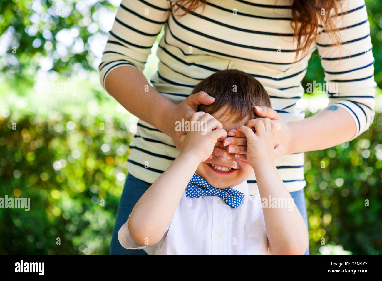 Mother covering son's eyes Stock Photo Alamy