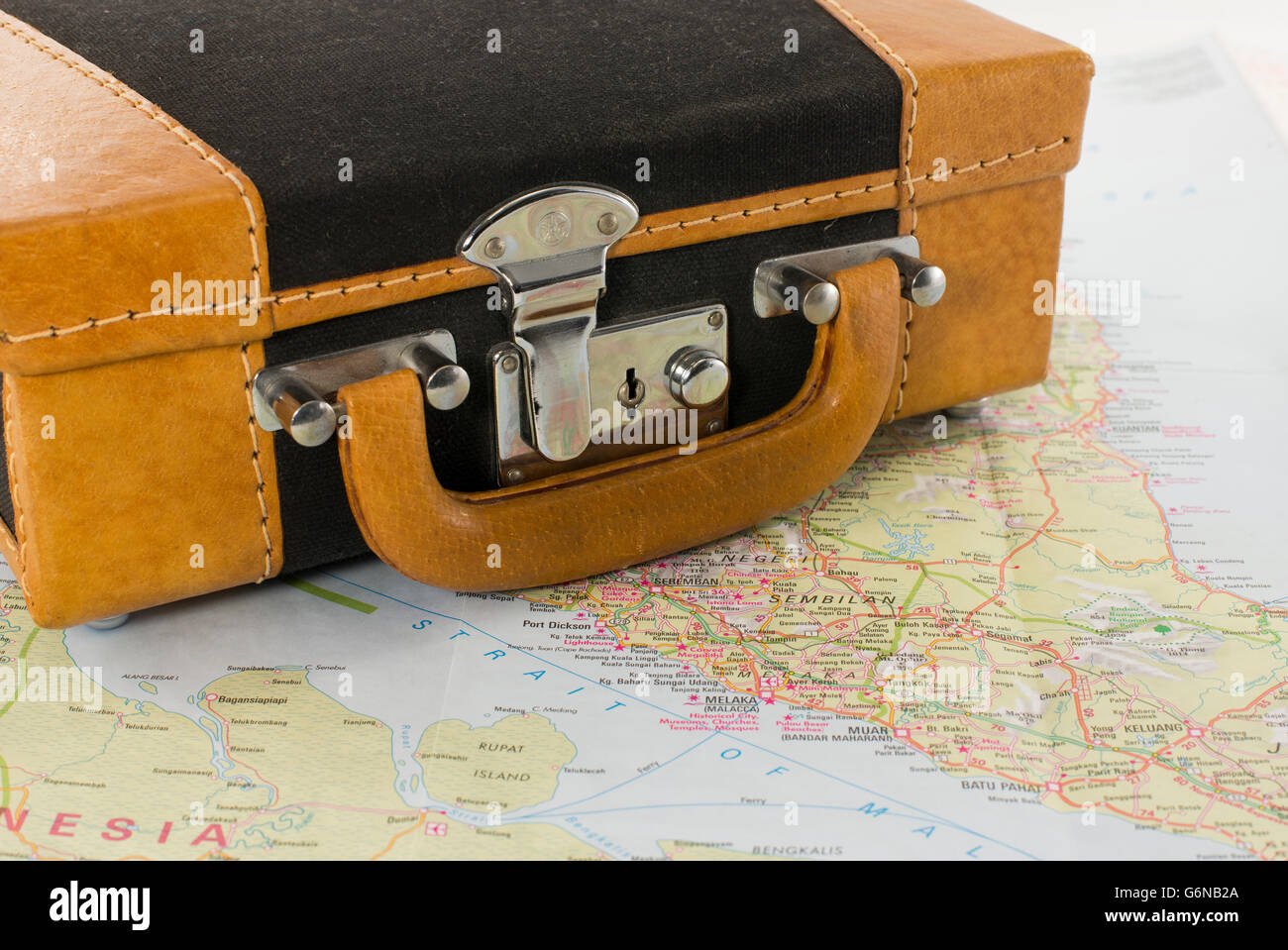 brown suitcase om map for travel the world Stock Photo