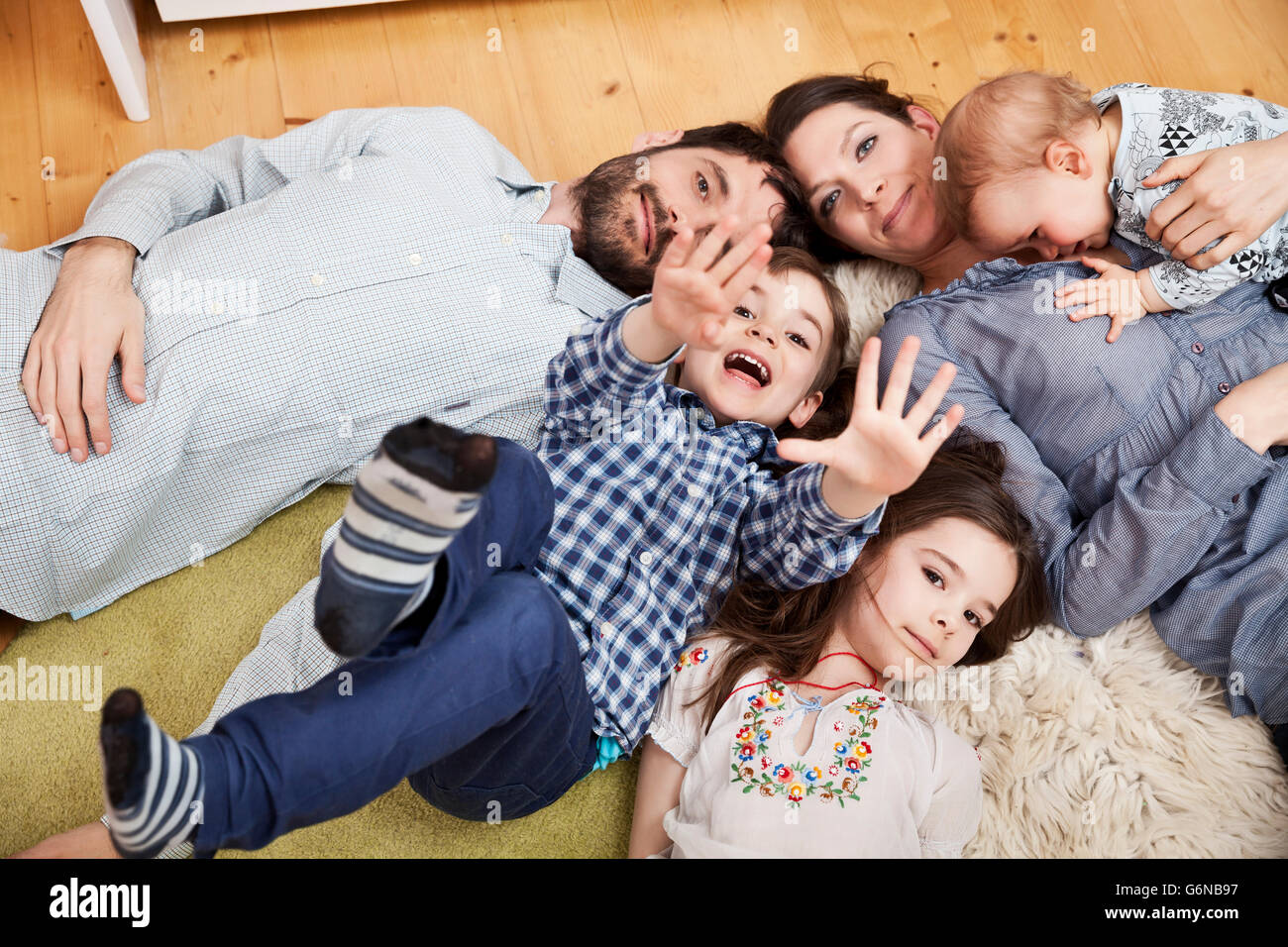 Woman group children lying down hi-res stock photography and images - Alamy