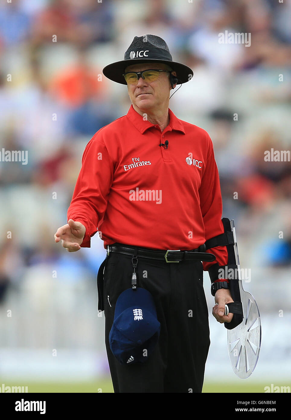 Umpire Bruce Oxenford wears arm protection for the game between England