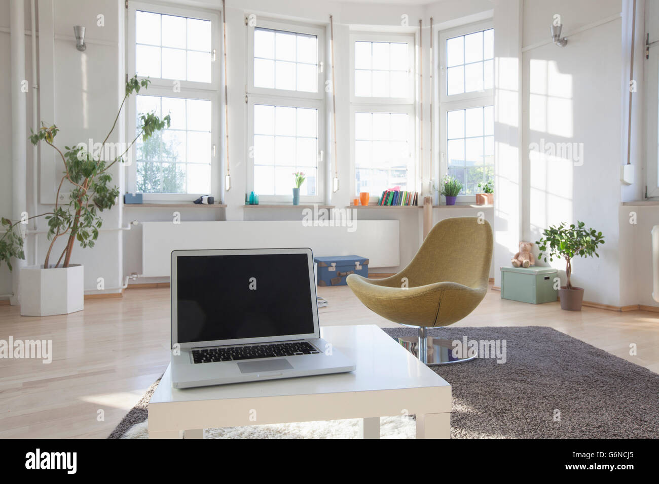 Home interior with laptop and chair Stock Photo