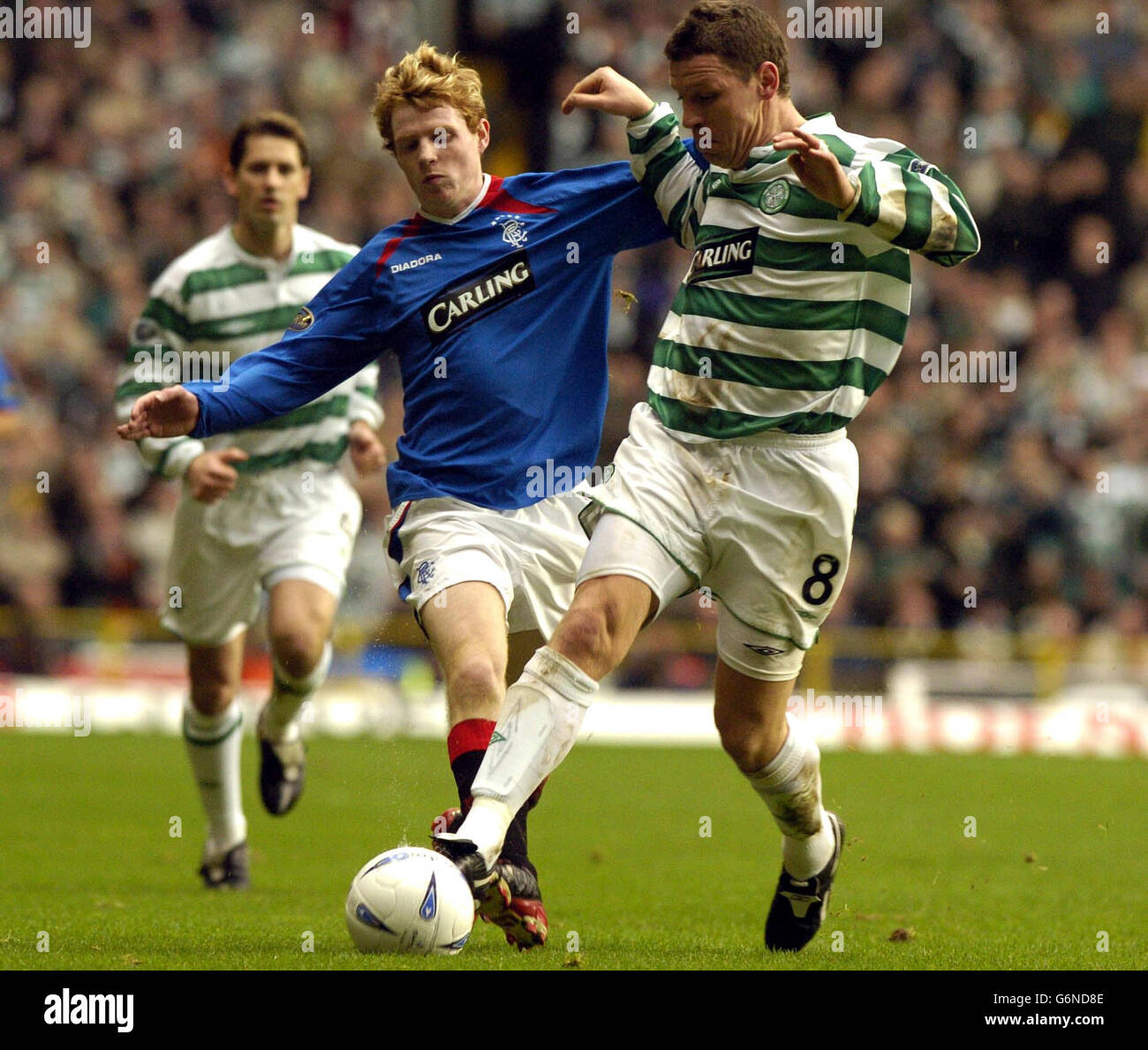 Rangers' Chris Burke (left) challenges Celtic's Alan Thompson during the Bank of Scotland Scottish Premiership match at Celtic Park, Glasgow. EDITORIAL USE ONLY Stock Photo