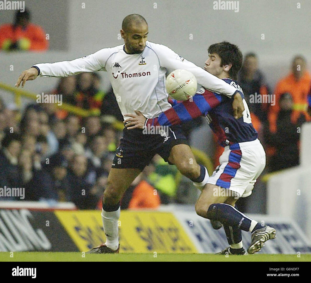 Tottenham Hoptspur's striker Freddie Kanoute tussles with Crystal Palace's Danny Butterfield (R) during the FA Cup Third Round match at Tottenham's White Hart Lane ground in London. Stock Photo