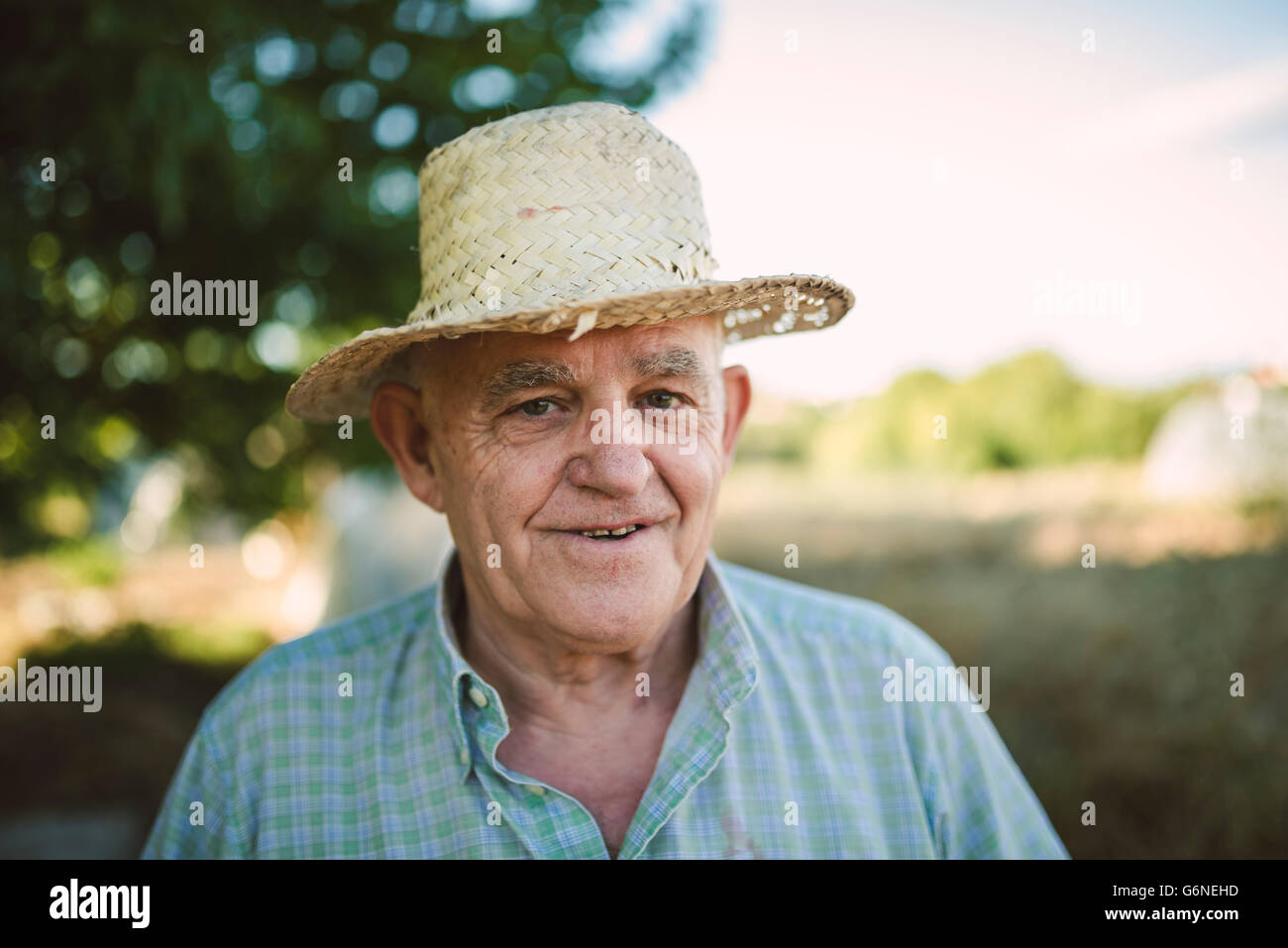 Portrait Of Smiling Farmer Wearing Straw Hat Stock Photo Alamy   Portrait Of Smiling Farmer Wearing Straw Hat G6NEHD 