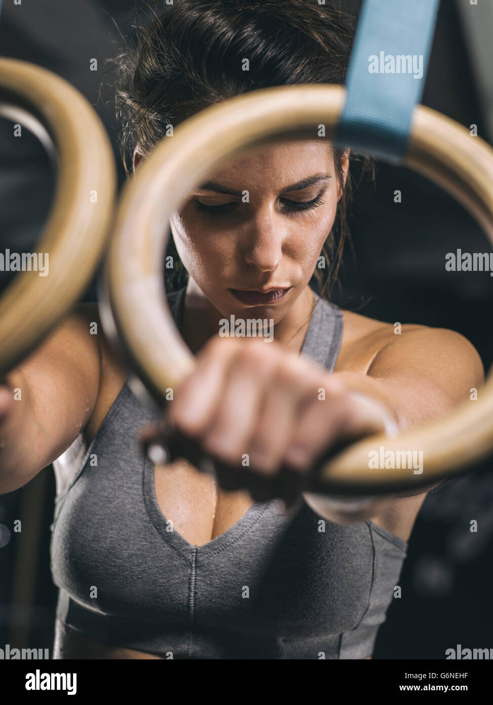 Female athlete, hand on gymnastic ring Stock Photo - Alamy