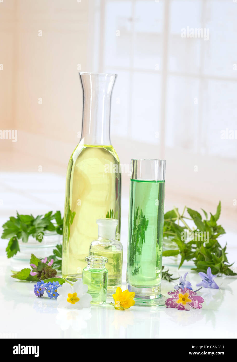 essential oils for aromatherapy treatment with fresh herbs Stock Photo