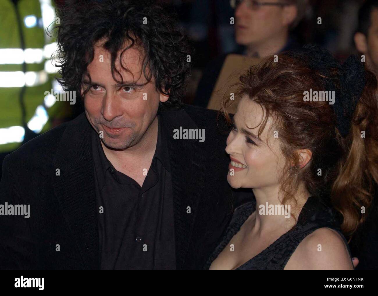 Director Tim Burton with his partner actress Helena Bonham Carter arrive at  the UK gala celebrity premiere of his latest film Big Fish, at the Warner  Village, Leicester Square, central London Stock