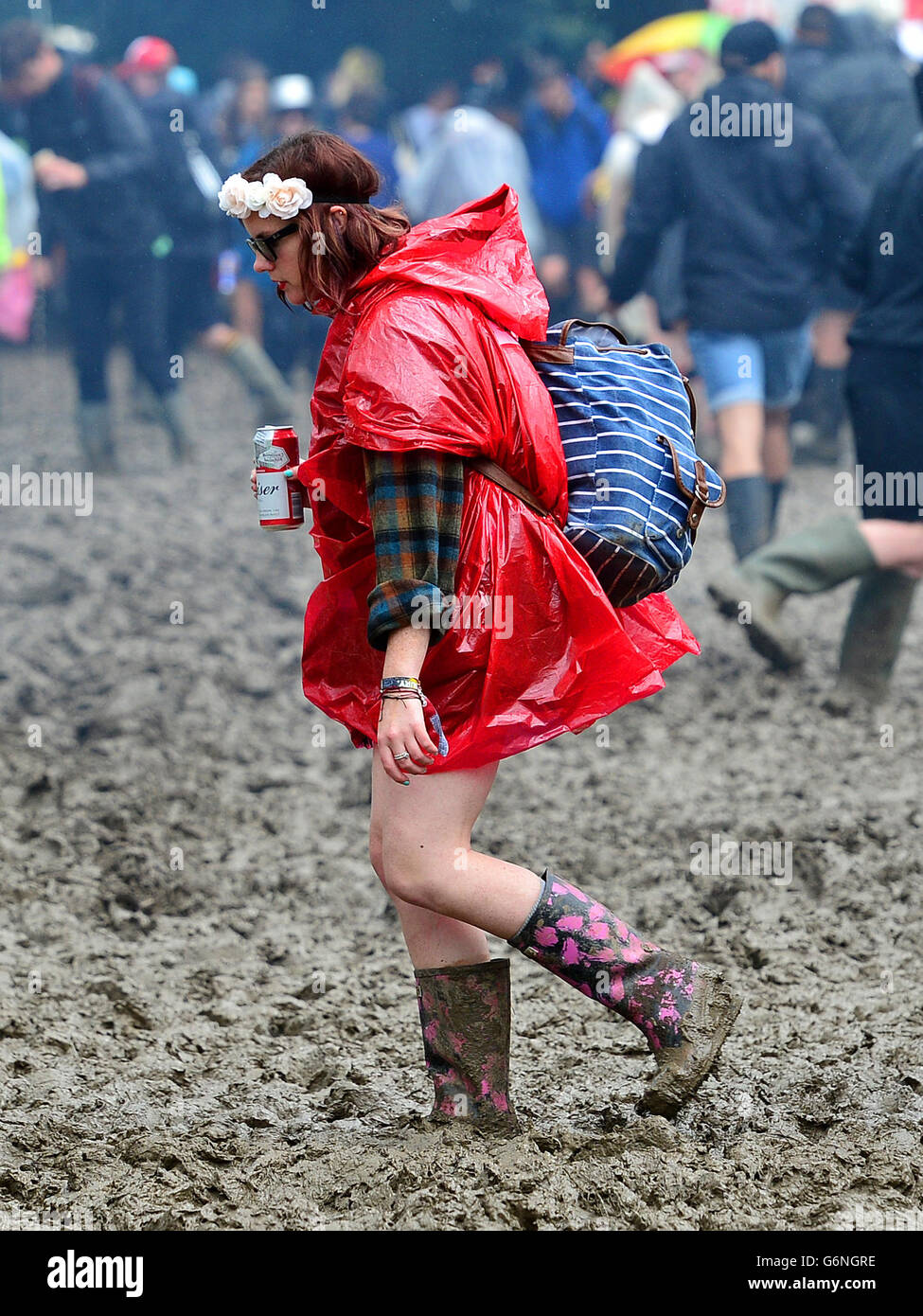 A festivalgoer in the mud at the Glastonbury Festival, at Worthy Farm in Somerset. PRESS ASSOCIATION Photo. See PA story SHOWBIZ Glastonbury. Picture date: Friday June 24, 2016. Photo credit should read: Ben Birchall/PA Wire Stock Photo