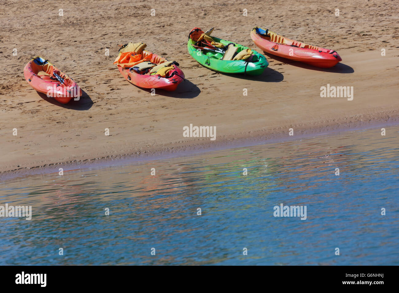 Colourful canoes at the beach, Atlantic coast, Morocco. Stock Photo