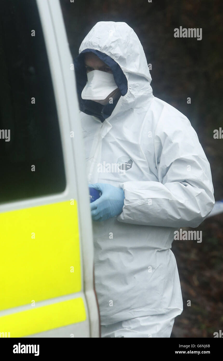 A person in a forensics suit attends the scene near Dunvegan Avenue in Kirkcaldy, after a child's body was discovered by police searching for missing three-year-old Mikaeel Kular. PRESS ASSOCIATION Photo. Picture date: Saturday January 18, 2014. See PA story MISSING Boy. Photo credit should read: Danny Lawson/PA Wire Stock Photo