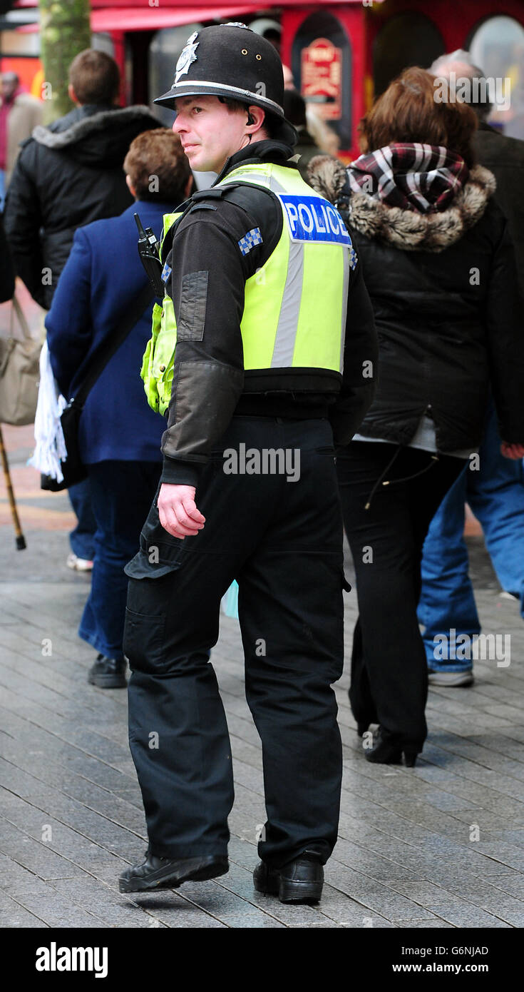 A Police Officer Patrols The Streets Of Birmingham City Centre Stock ...