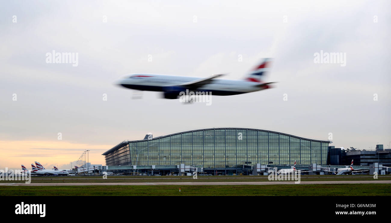 Planes land at Heathrow Airport as extra runways at Heathrow and Gatwick are among the options put forward by the Government-appointed Airports Commission. Stock Photo