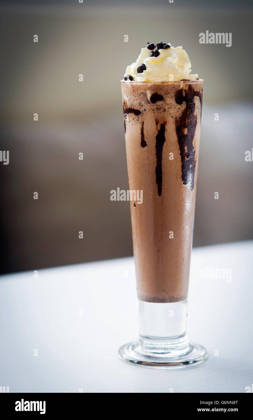 gourmet chocolate and ice cream milkshake dessert in tall glass Stock