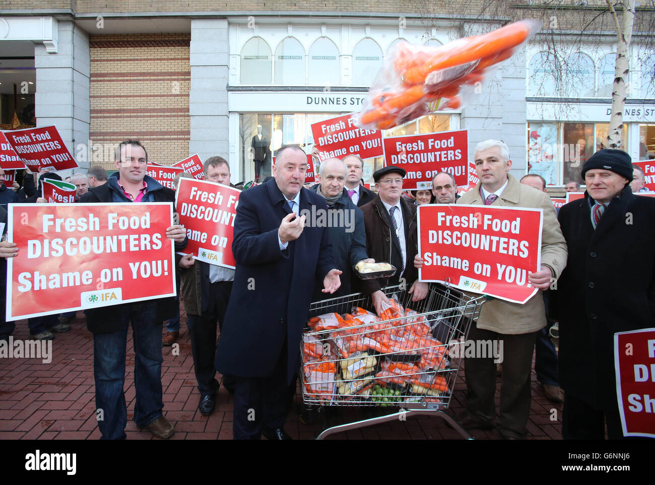Irish Farmers Association (IFA) president John Bryan (centre) hands out