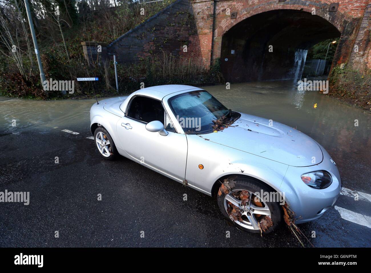 An abandoned car in Leatherhead, Surrey after floods hit the area. Many people are facing a miserable Christmas Day in the wake of the stormy weather with thousands either evacuated from their homes or left without power. Stock Photo