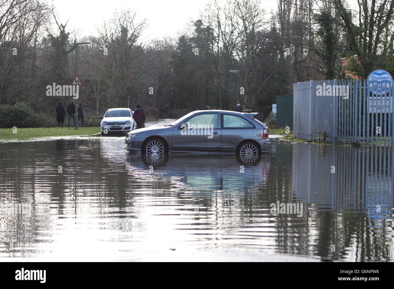A stranded car in a flooded road in Godalming in Surrey after floods hit the area. Many people are facing a miserable Christmas Day in the wake of the stormy weather with thousands either evacuated from their homes or left without power. Stock Photo