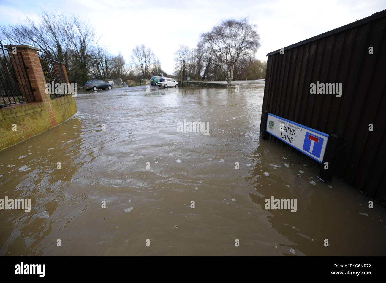 Roads are submerged in the overflowing River Stour at Ilford Bridge Home Park, near Bournemouth, where flooding has caused the evacuation of residents. Stock Photo
