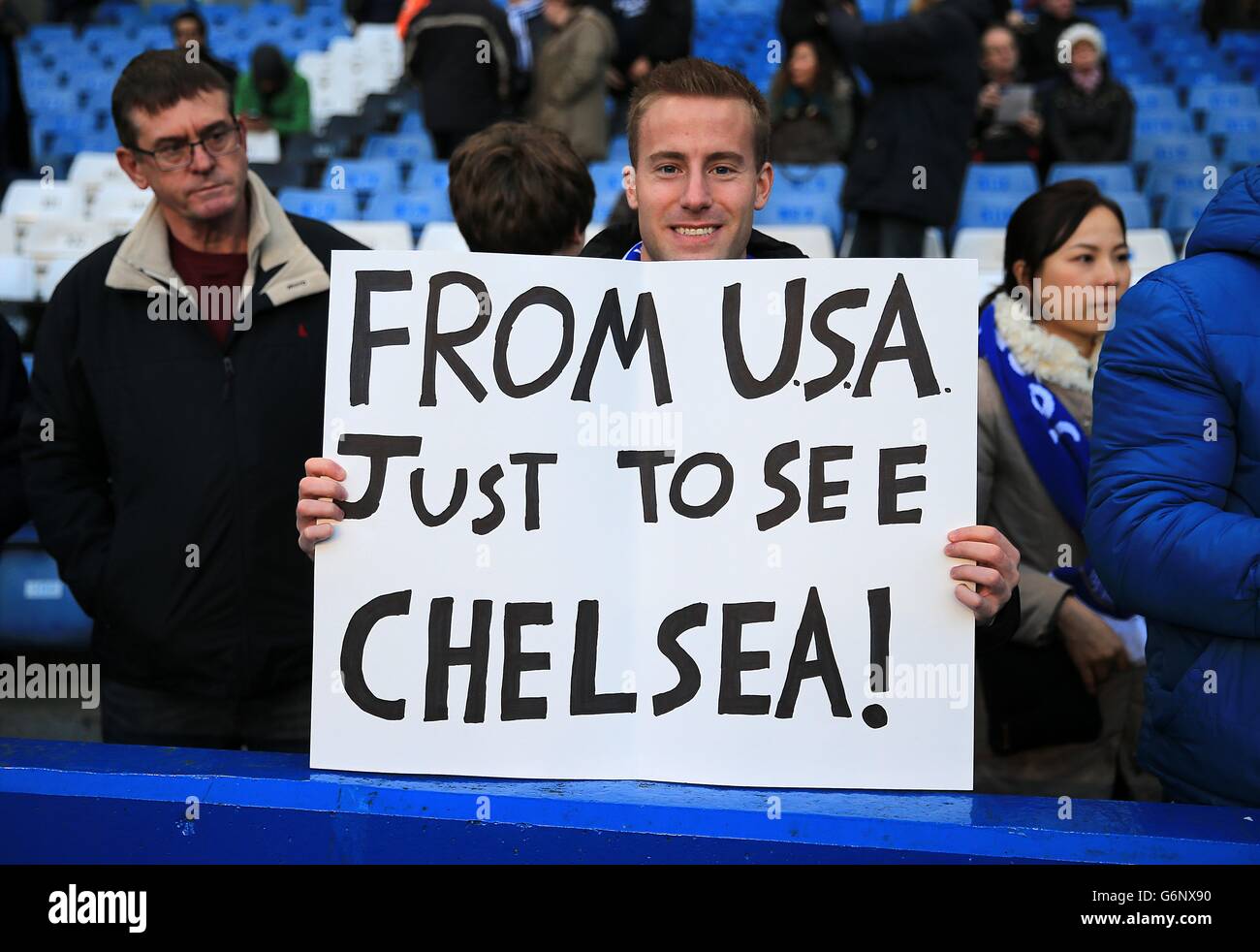 Soccer - Barclays Premier League - Chelsea v Liverpool - Stamford Bridge. A fan holds a sign in the stands which reads 'From USA just to see Chelsea' Stock Photo