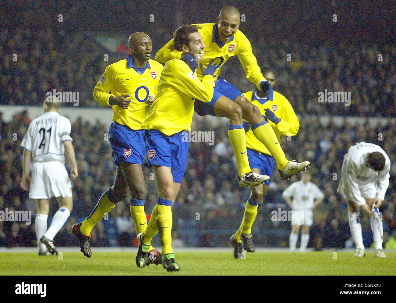 Arsenal's Edu celebrates his goal against Leeds United with teammate Gilberto (right), during the FA Cup Third Round match at Elland Road, Leeds. Stock Photo