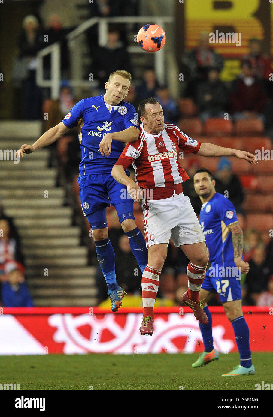 Leicester City S Ritchie De Laet Out Jumps Stoke City S Charlie Adam During The Fa Cup Third Round Match At The Britannia Stadium Stoke On Trent Stock Photo Alamy