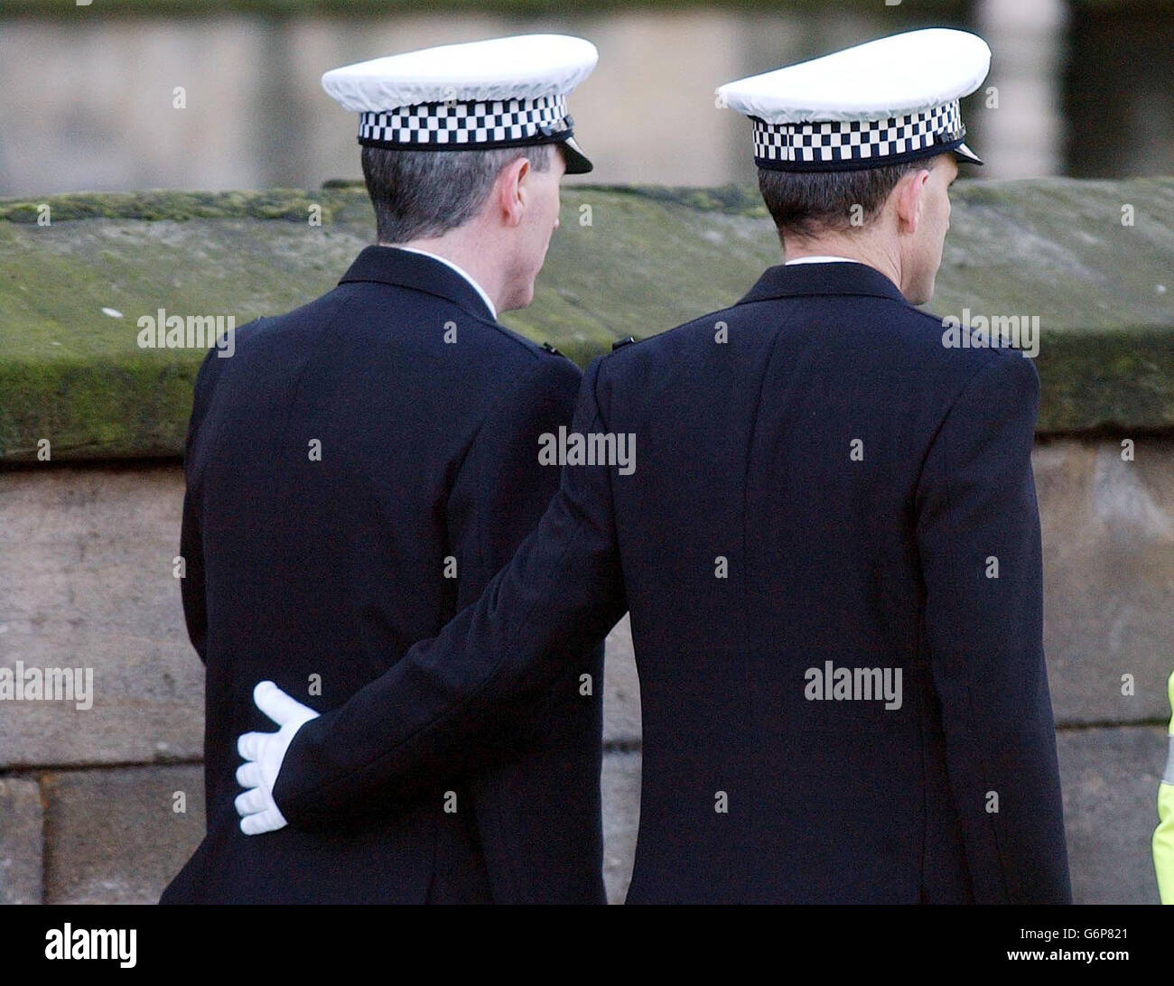 Pc Neil Roper Pc Neil Roper (left) is comforted during the funeral service of their ...